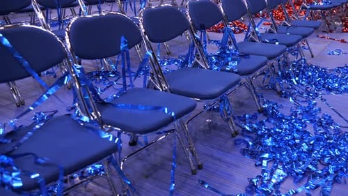 Rows of Chairs Decorated with Blue Confetti