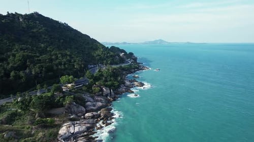 Experience the Beautiful Aerial View of a Stunning Coastline with the Clear Turquoise Waters
