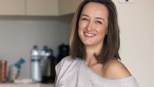 Woman Smiling Portrait in Kitchen Interior