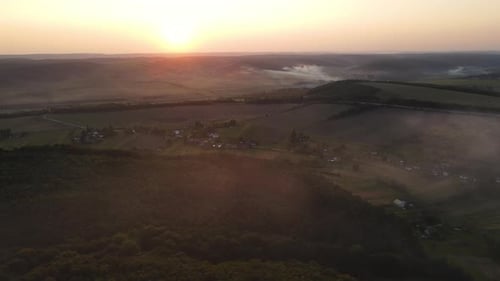 Aerial Panoramic View on the Lands with Evening Fog and Scenic Sunset
