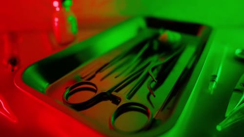 Surgical Tools with Dramatic Red and Green Lighting