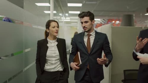 Business Discussion in Office Corridor