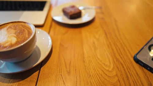 Close Up Coffee, Laptop, Phone, and Brownie