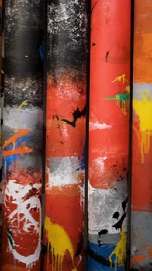 Close Up of Interesting Composition with Rotating Tubes with Bright Paintings Concept Spinning