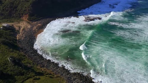 Foamy Sea Waves Washing Rocky Shore At Royal National Park In New South Wales, Australia - aerial sh
