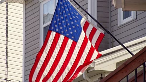 United States Flag Flying Beside Rural Home In American Countryside