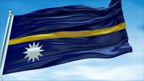 Nauru Flag Moving in the Wind Against the Blue Sky
