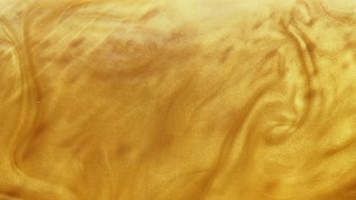 Shimmering Gold Liquid in Abstract Motion