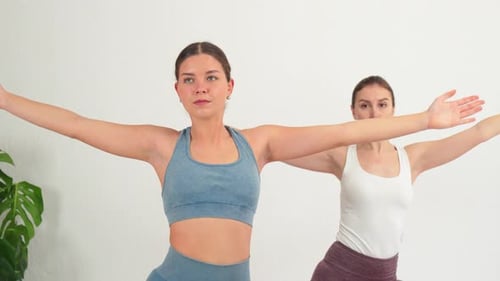 Women Doing Yoga Exercises Indoors