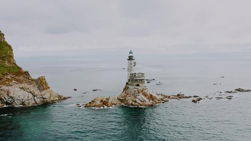 An Abandoned Old Lighthouse on the Cliffs By the Sea