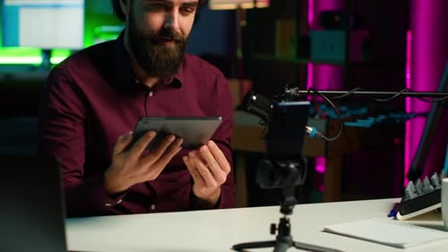 Man Recording Podcast with Tablet in Studio