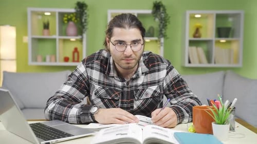 Determined and ambitious, the male student works for his goals.