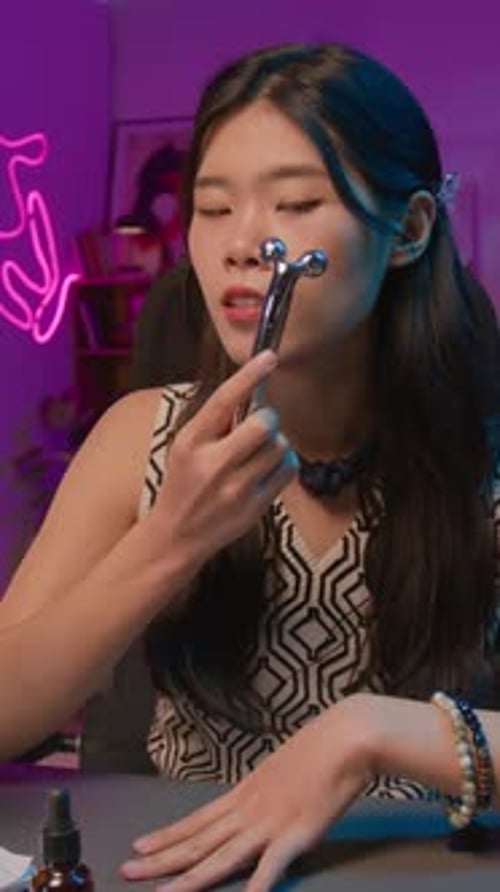 Woman Demonstrates How to Use Facial Roller