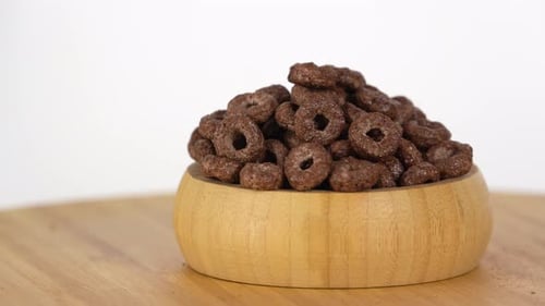 Chocolate Cereal Rings in a Wooden Bowl