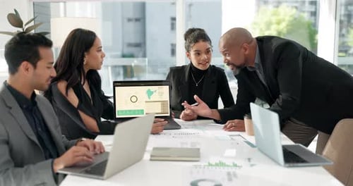 Diverse Team Collaborates on Business Strategy in Modern Office