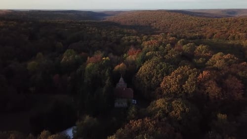 Amazing autumn colors with an old forest cabin