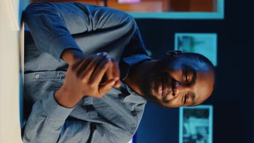 Man Talking in Office At Night