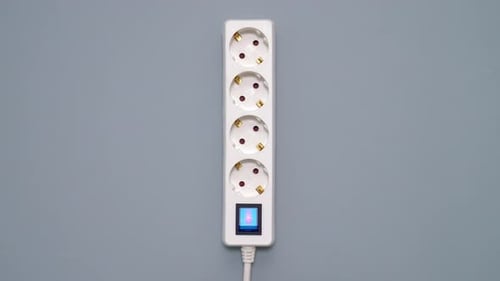 Extension Cord Plugged Into Outlet