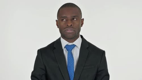 Man in Suit Looking Thoughtfully to Either Side