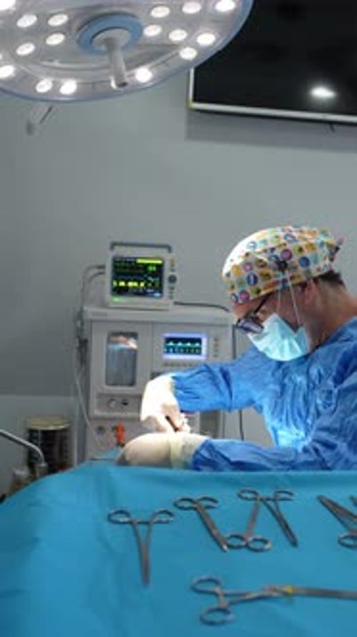 Surgeon Performing Operation in Hospital Operating Room