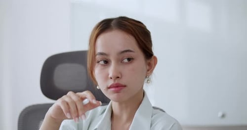 Businesswoman in a meeting, brainstorming and taking notes