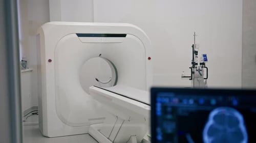 Computer tomography equipment in the clinic a screen with a tomographic image in the medical room