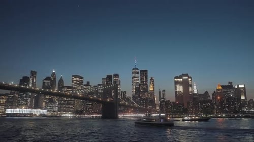 The view of New York skyline and Manhattan bridge at night.