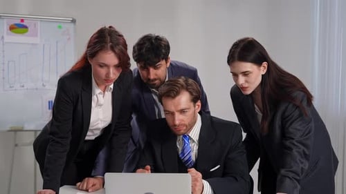 Excited Business Team Celebrating Success in Office