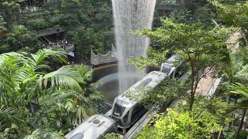 Singapore Jewel Indoor Waterfall Vortex at Changi Airport - train passing underneath on Monorail Tra