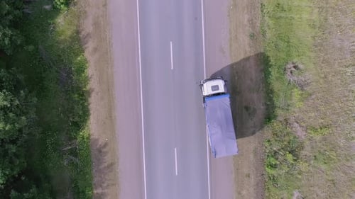 Truck is driving on highway on summer day