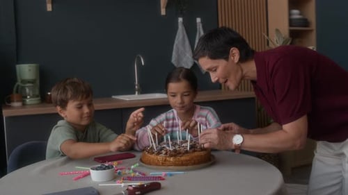 Family Prepares Birthday Cake in Sunny Kitchen