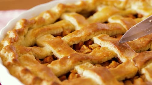 Food, Culinary and Baking Concept - Close Up of Apple Pie Slicing