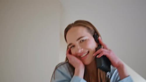 Woman Dancing in Pajamas With Headphones