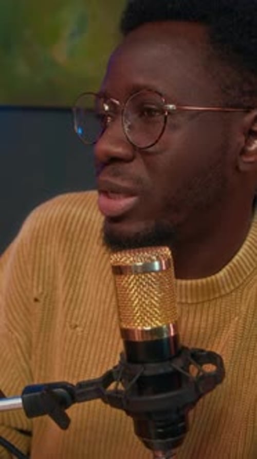 Podcast Host Speaking in Microphone during Studio Recording
