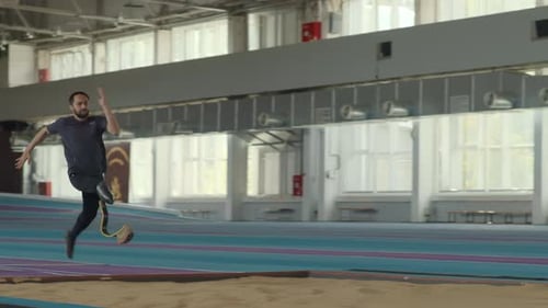 Athlete With Prosthetic Leg Doing Long Jump