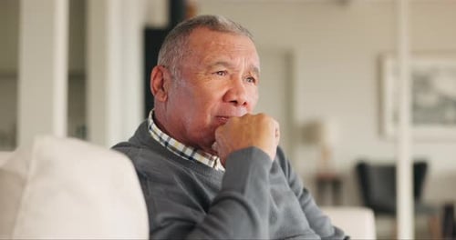 Sofa, retirement and senior man thinking with a memory or brainstorming home