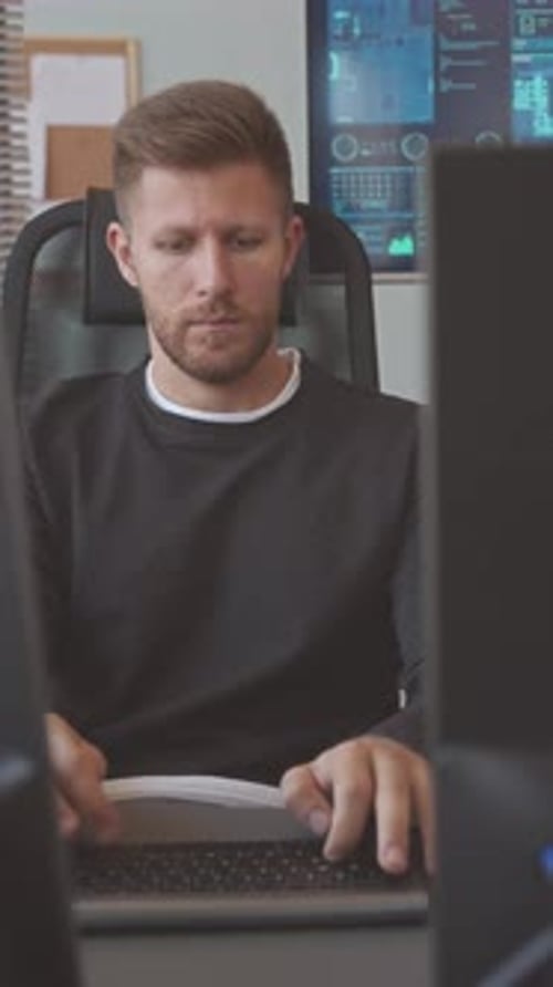 Programmer Working on Computer in Office