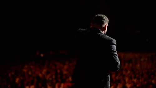 Presentation at a Business Conference for Office Workers The Speaker Addresses the Audience on Stage