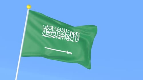 Waving Flag of Saudi Arabia Against Blue Sky