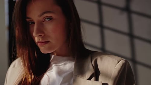 Woman with Blazer in Window Light