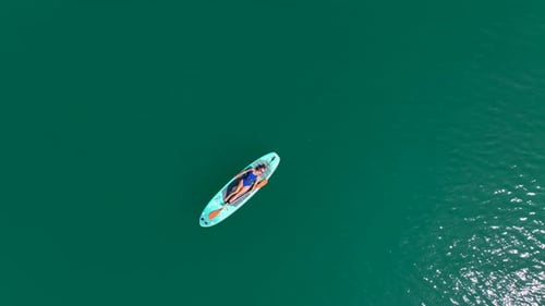 Aerial View Paddleboarders Relaxing in the Large Green Canyon Soaking Up Summer Fun