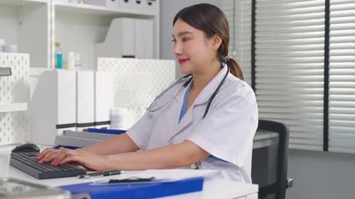 Asian female doctor use laptop give medical advice to a patient online.