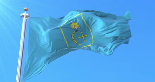 Realistic Flag Waving with Emblem on Blue Sky