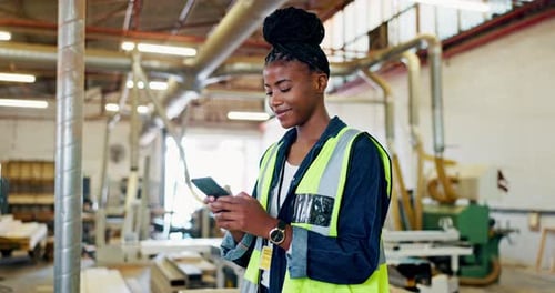 Construction, warehouse and smartphone of woman with smile for funny email, networking or research