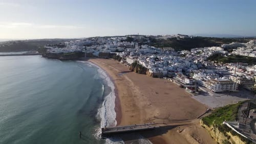Aerial View Of Empty Beautiful Beach In Albufeira With Gentle Waves Breaking On Shoreline. Push Forw