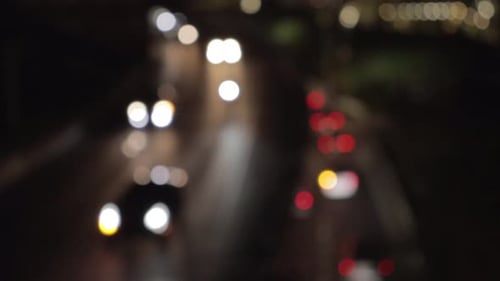 Beautiful Bokeh from Car Headlights on a Double Decker Highway in a Big City at Night