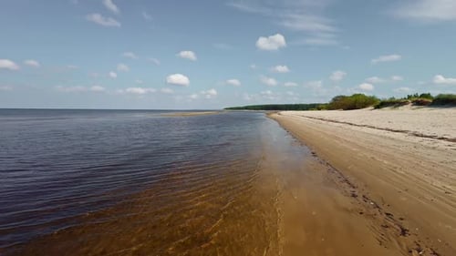 A Serene and Beautiful Coastal Landscape Featuring Calm Waters and a Sandy Beach Perfect for