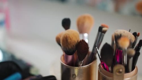 Closeup of Professional Makeup Brushes on the Table