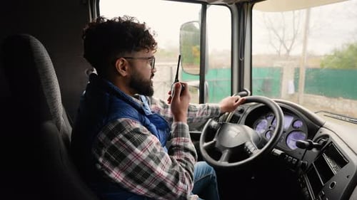 Professional Truck Driver Communicating Using a Cb Radio