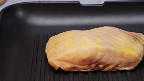 Cooking Fillet Sturgeon Beluga White Fat Fish on Grill or Frying Pan with Oil Closeup Roast Healthy